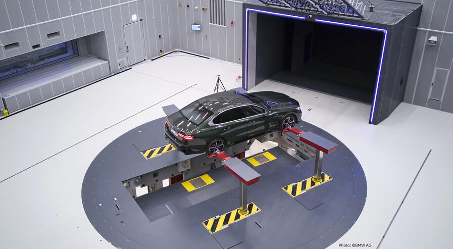 Car on vehicle lifting platform in an acoustic chamber